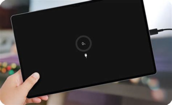 Why is my Lenovo tablet not charging when plugged in?